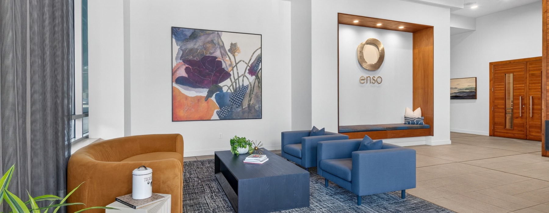 a lobby with a couch and chairs