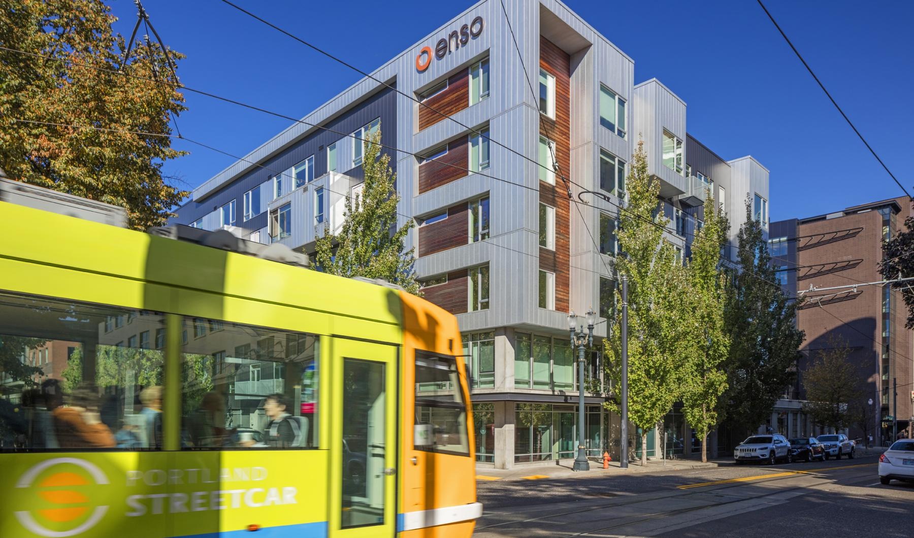 Close to the center of everything a yellow bus on the street