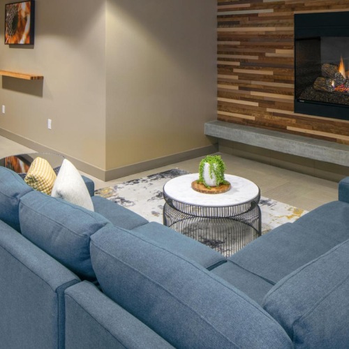 Settle into comfort at Enso a lounge with a fireplace