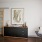 a room with a dresser and a chair