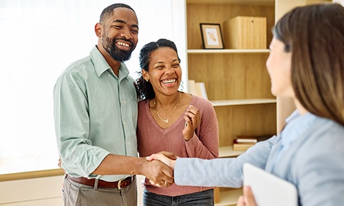 man and woman shaking hands