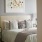 a bed with a white headboard