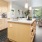 a kitchen with a bar and a stove