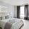 a bedroom with a bed and a chair