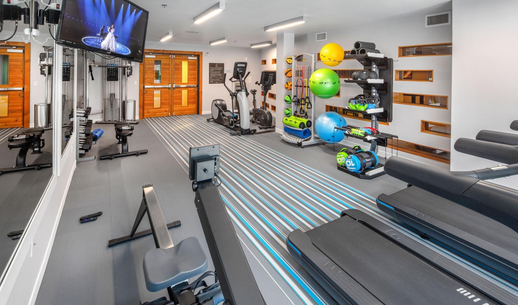 State-of-the-art amenities a gym with exercise equipment
