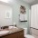 a bathroom with a mirror sink toilet and shower